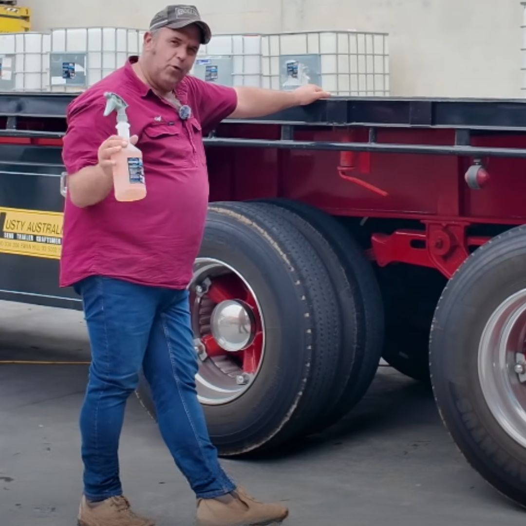 RG degreaser being applied to truck tyres during a no-touch truck wash demo